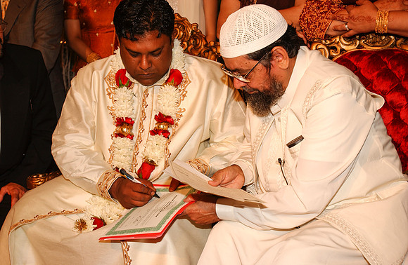 Groom signing Papers