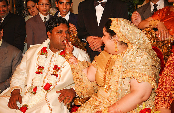Bride feeding Groom-1