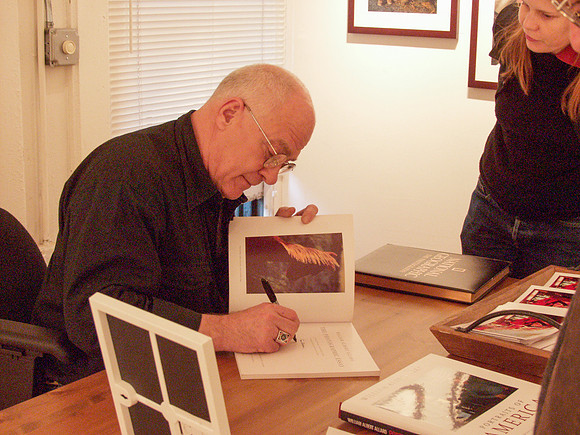 Allard book signing with girl nearby